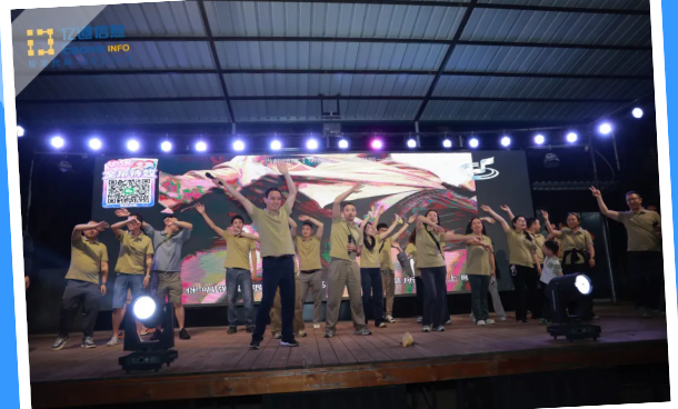 Colleagues dancing together at Emdoor’s bonfire team-building event